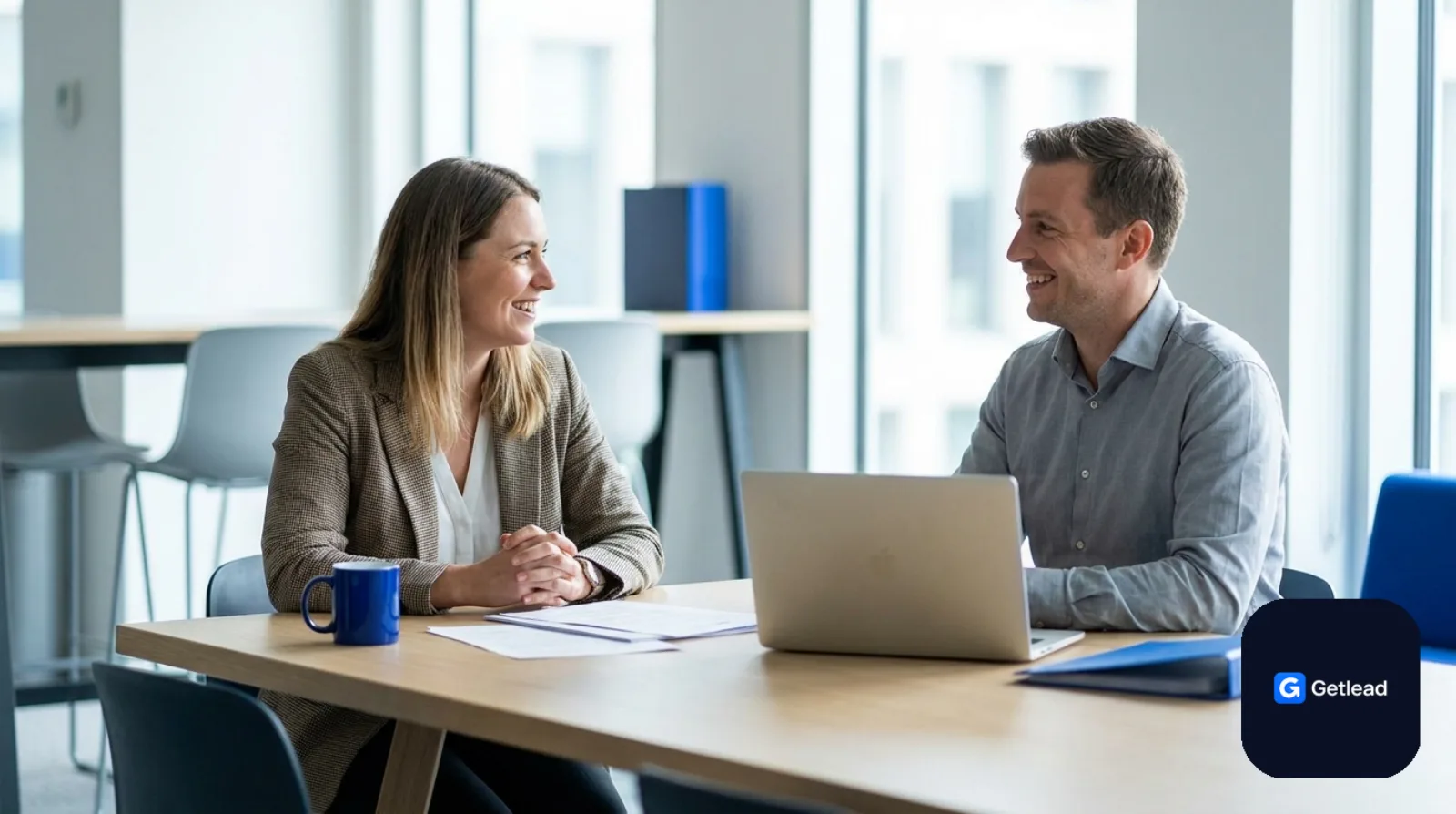 Recruiter interviewing a candidate at a bright office table