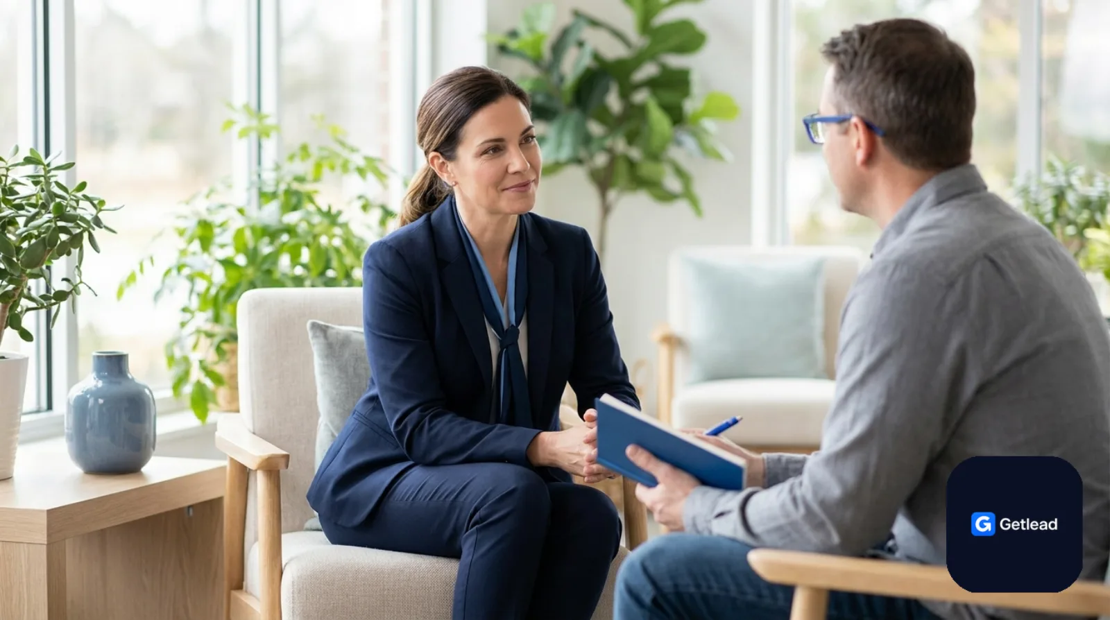 Counselor in a supportive conversation at a modern therapy center